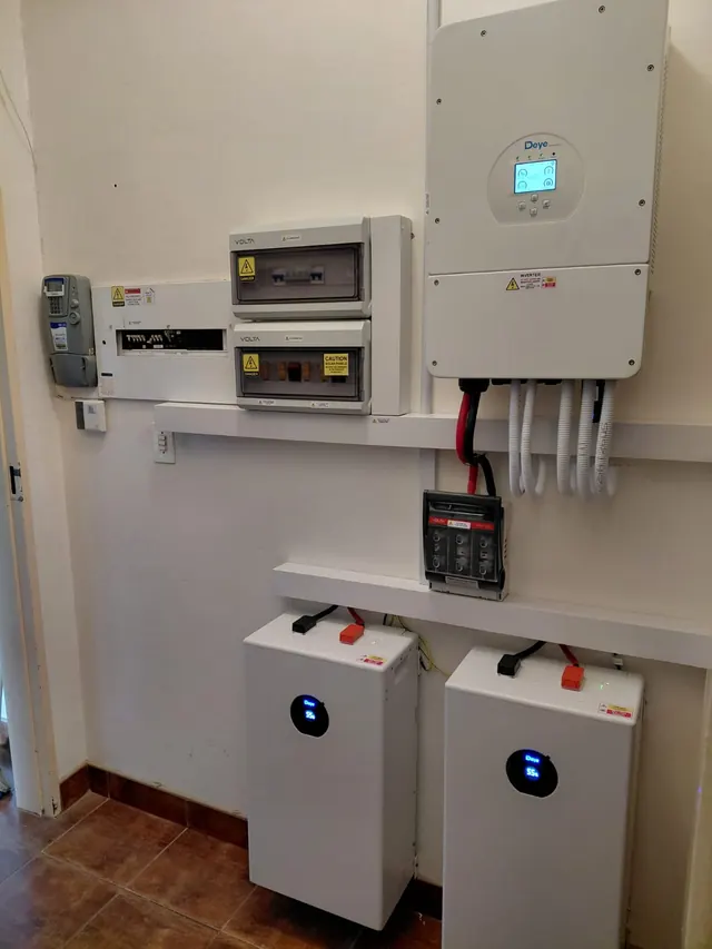 A Deye hybrid inverter with Volta distribution boards and floor-standing batteries installed by Maxsolair