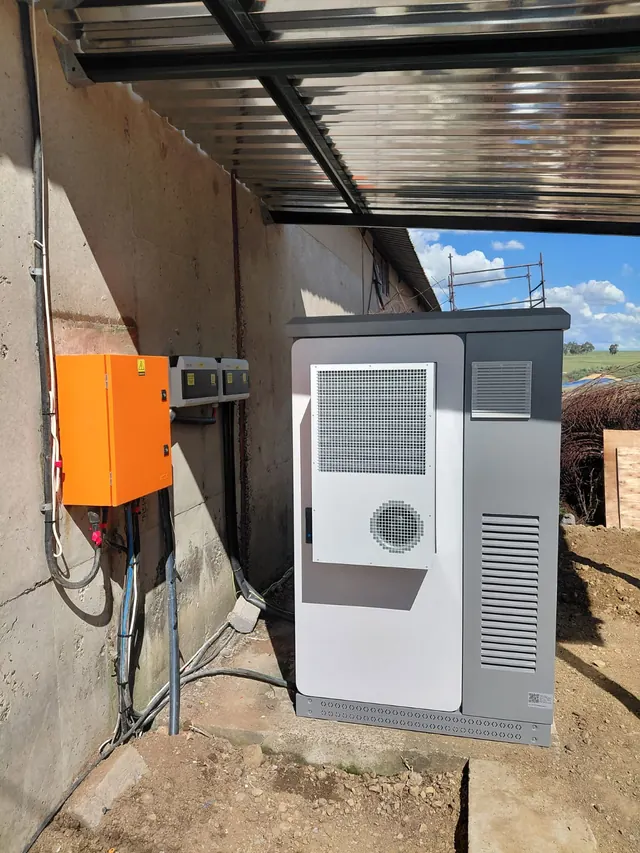 Slangfontein: An outdoor solar power enclosure and switchgear cabinet installed on a farm site.
